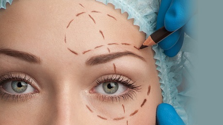 Woman with Dollar Sign Penciled on Face