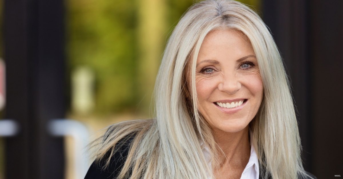 A woman smiles after a facelift in Denver, CO