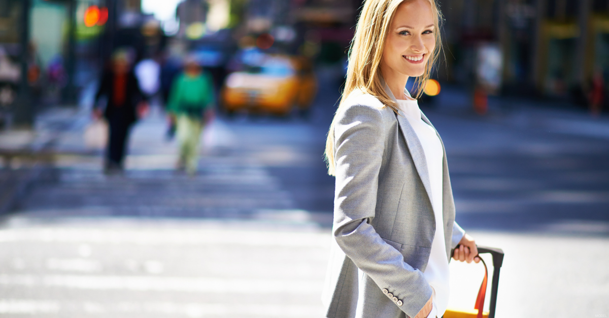 smiling woman with suitcase